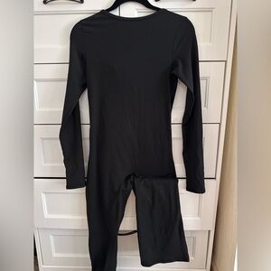 Qincen Women’s open back long sleeve tight jumpsuit Size M